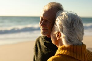 Anal Sphincteroplasty - Old couple relaxing at the beach